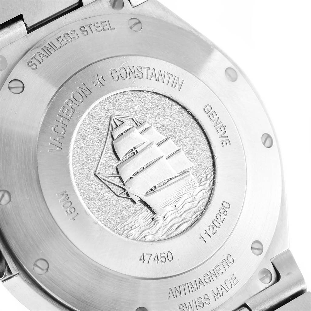 The image shows the case back of a Vacheron Constantin Overseas 47450/B01A-9226 Men's Stainless Steel Silver Dial 47450/B01A-9226 Men's Stainless Steel Silver Dial watch, with engraved details and a ship motif.