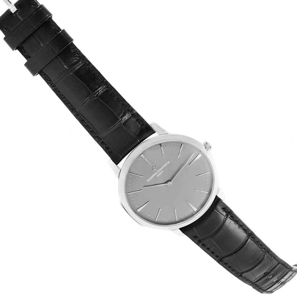 The image shows a top-down view of a Vacheron Constantin Patrimony 81180/000P-9539 Men's Platinum Grey Dial 81180/000P-9539 Men's Platinum Grey Dial watch, including its face, strap, and clasp.