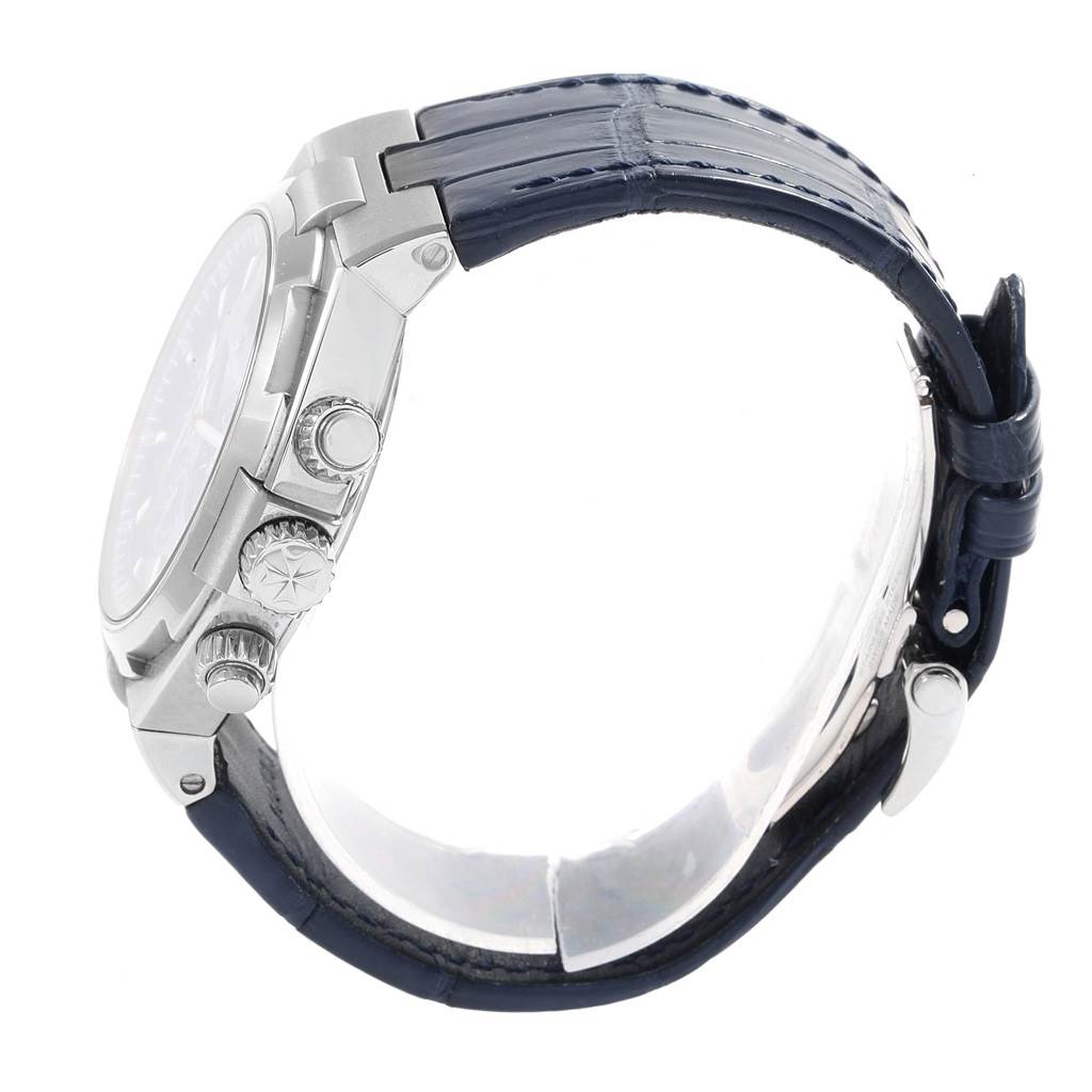 This side-angle view of the Vacheron Constantin Overseas 49150.B01A.9097 Men's Stainless Steel Blue Dial 49150.B01A.9097 Men's Stainless Steel Blue Dial watch shows the case, crown, pushers, and part of the blue strap.
