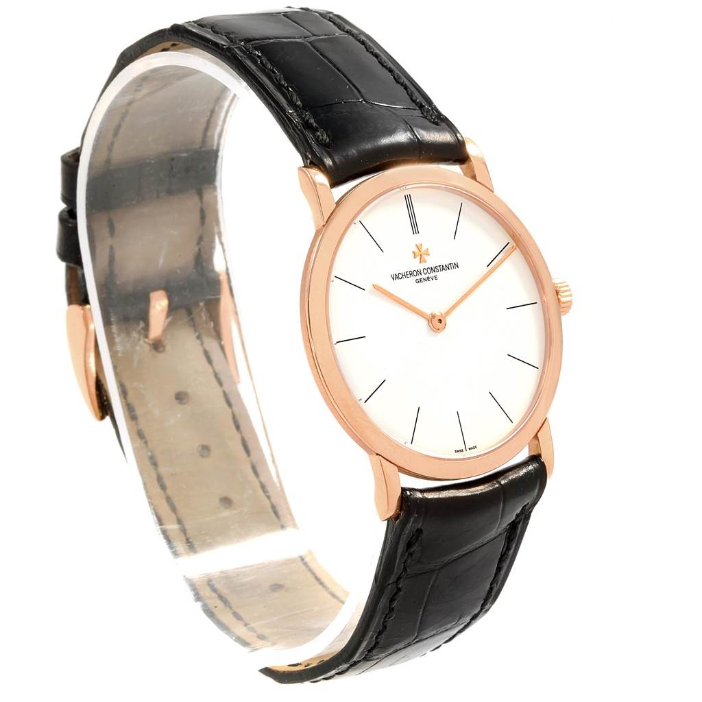 The image shows a side view of the Vacheron Constantin Patrimony 33093 Men's Rose Gold White Dial 33093 Men's Rose Gold White Dial watch, highlighting its black leather strap, gold case, and white dial.