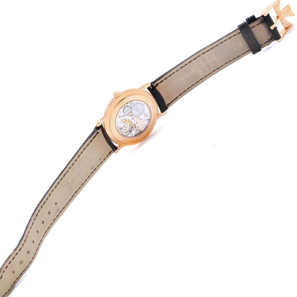 The image shows the back view of the Vacheron Constantin Patrimony 33093 Men's Rose Gold White Dial 33093 Men's Rose Gold White Dial model, highlighting its movement and leather strap.