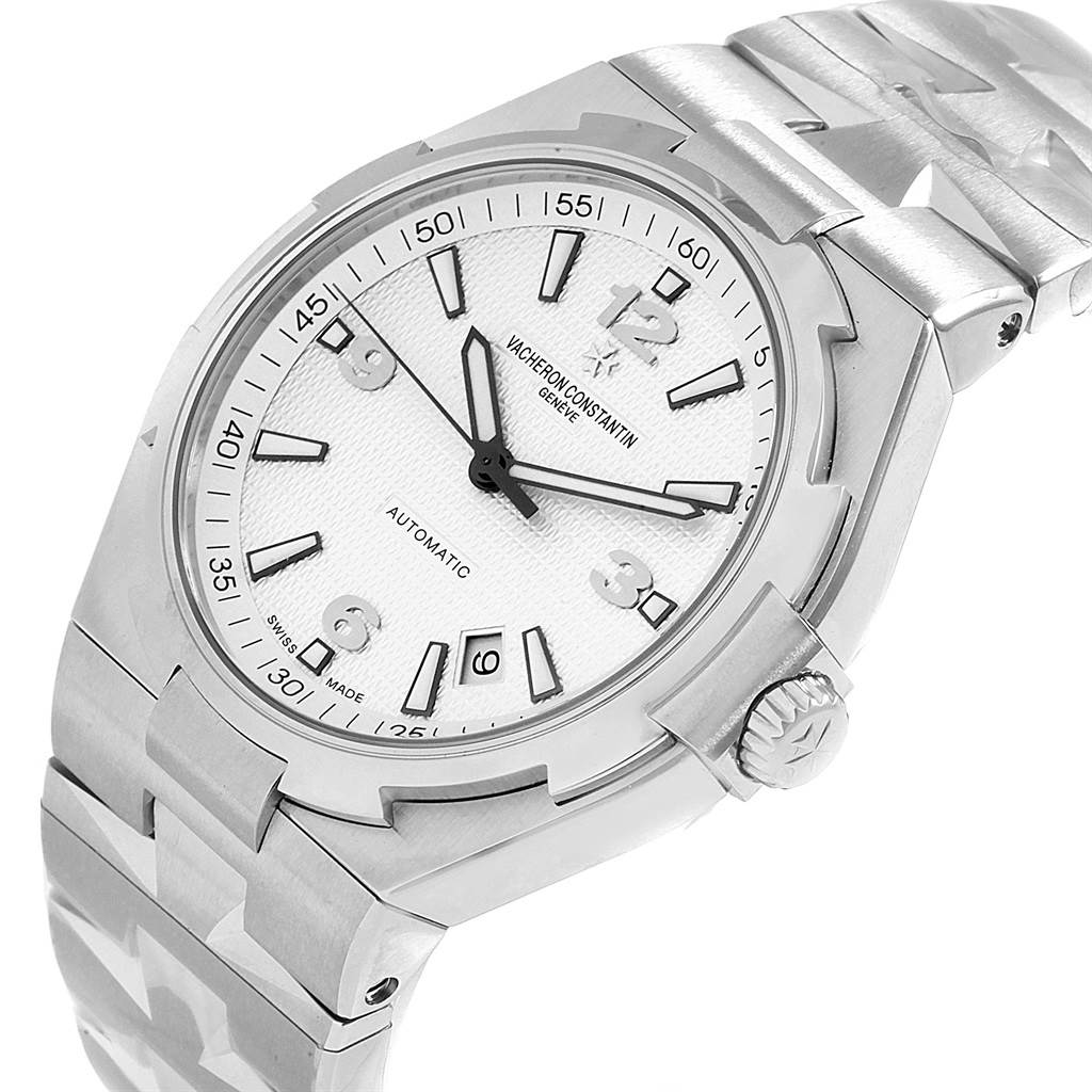 The image shows a Vacheron Constantin Overseas 47040/B01A-9093 Men's Stainless Steel Silver Dial 47040/B01A-9093 Men's Stainless Steel Silver Dial model watch from an angled view, highlighting the face, bezel, and part of the bracelet.