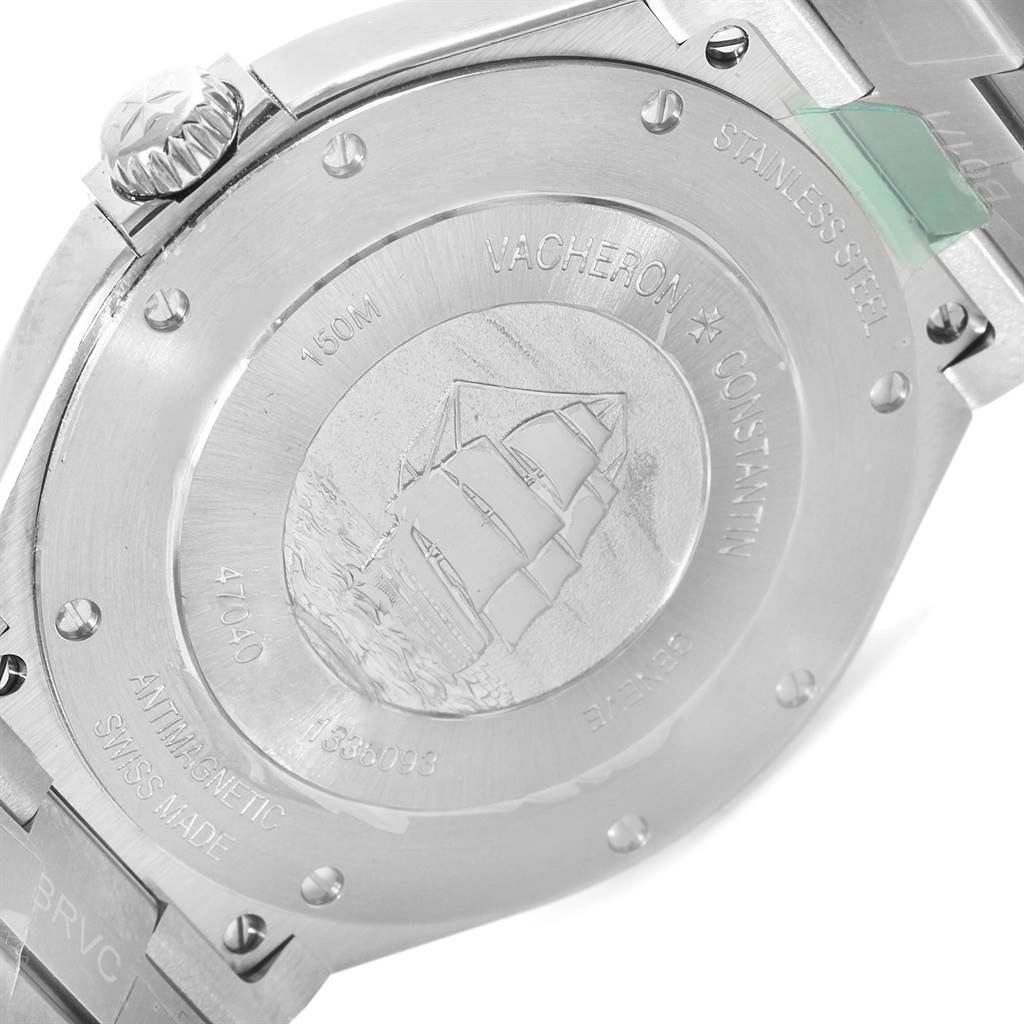 The image shows the stainless steel case back of the Vacheron Constantin Overseas 47040/B01A-9093 Men's Stainless Steel Silver Dial 47040/B01A-9093 Men's Stainless Steel Silver Dial watch, displaying engravings and a detailed ship illustration.