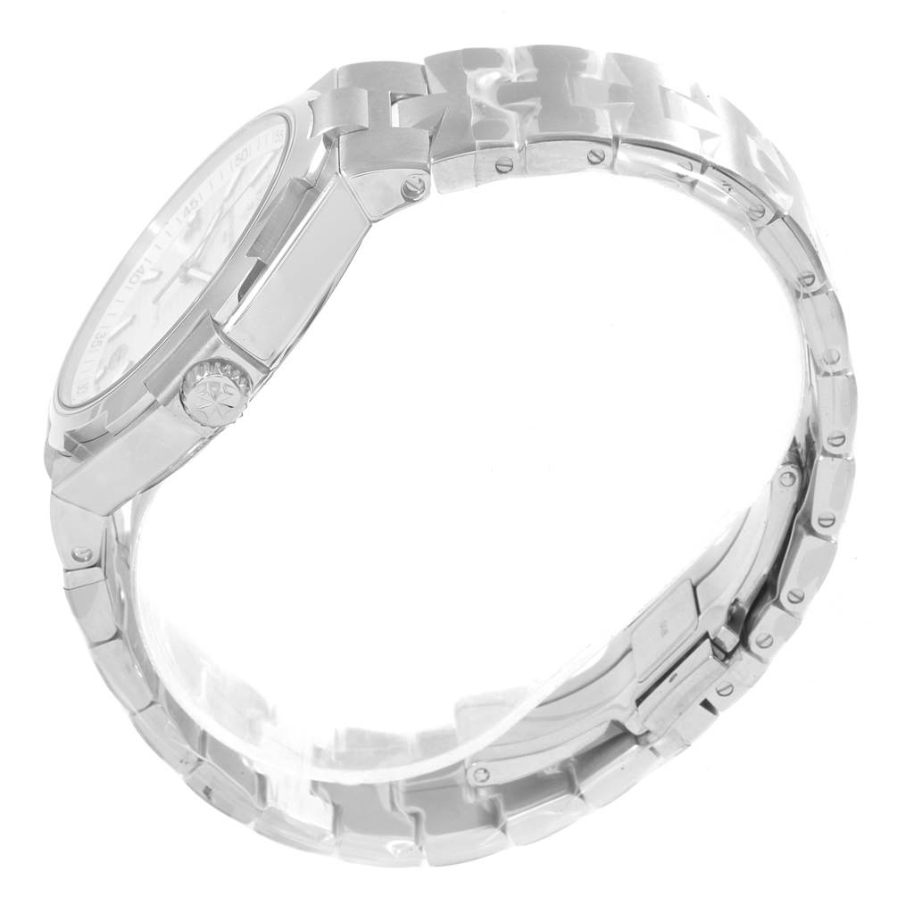 The image shows a side view of the Vacheron Constantin Overseas 47040/B01A-9093 Men's Stainless Steel Silver Dial 47040/B01A-9093 Men's Stainless Steel Silver Dial watch, highlighting the crown, case, and bracelet.