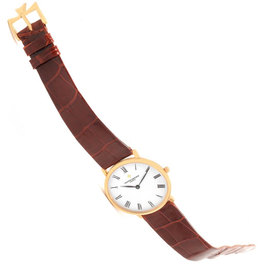 This image shows the Vacheron Constantin Patrimony 31160 Men
s Yellow Gold White Dial 31160 Men
s Yellow Gold White Dial watch at an angled top-down view, displaying the face, bezel, crown, and brown leather strap.