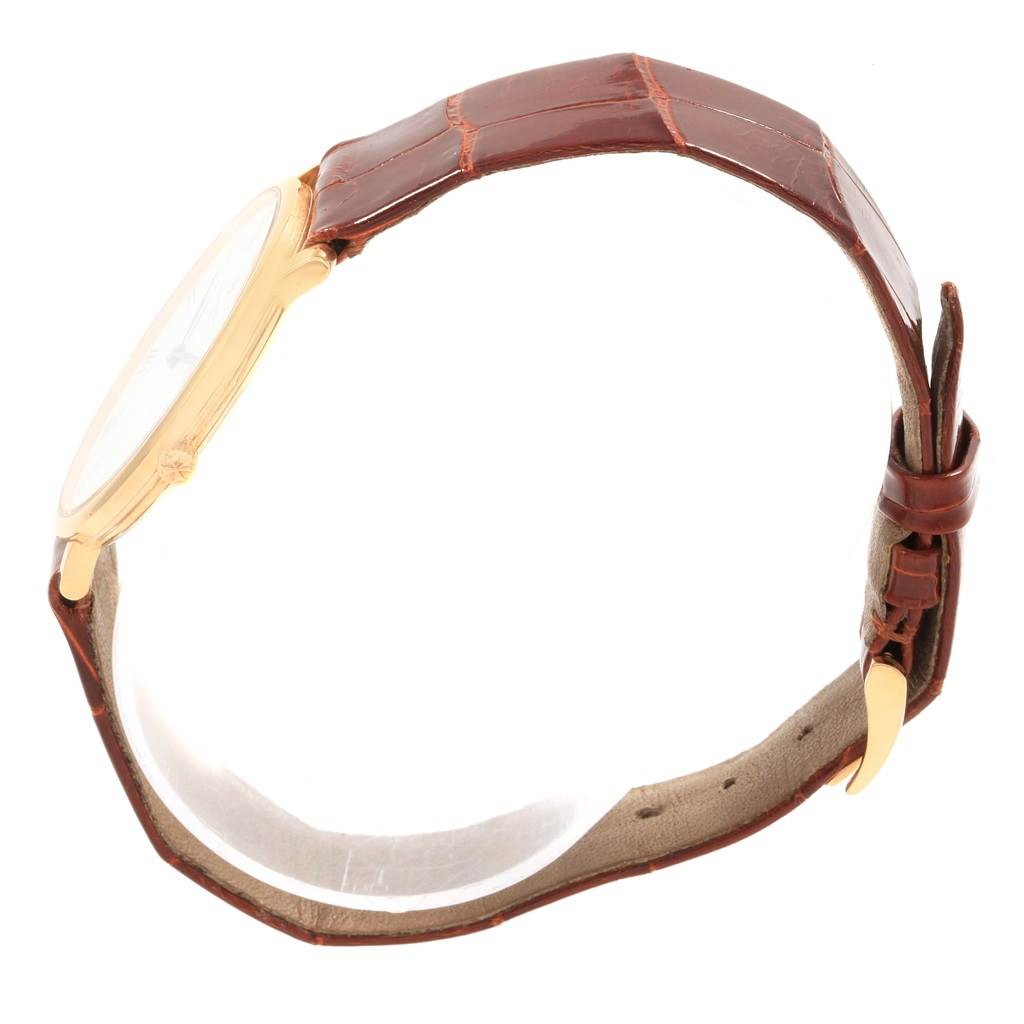 This image shows a side view of the Vacheron Constantin Patrimony 31160 Men
s Yellow Gold White Dial 31160 Men
s Yellow Gold White Dial watch, highlighting its brown leather strap and gold case.