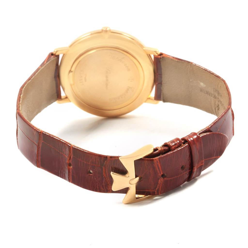 The Patrimony model by Vacheron Constantin is shown from the back, highlighting the clasp and leather strap.