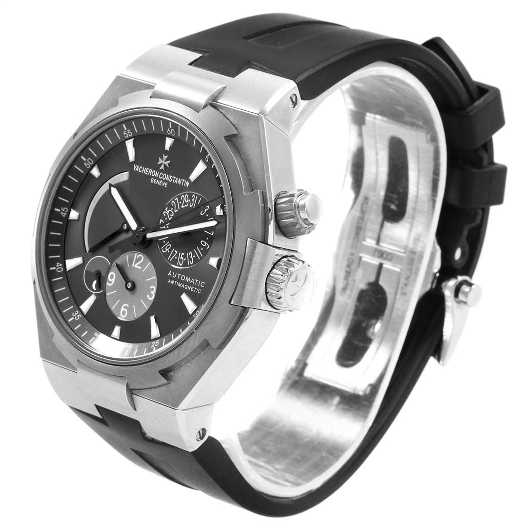 The image shows a side-angle view of a Vacheron Constantin Overseas 47450/000W-9511 Men's Stainless Steel Grey Dial 47450/000W-9511 Men's Stainless Steel Grey Dial watch, highlighting its case, bezel, dial, and rubber strap.