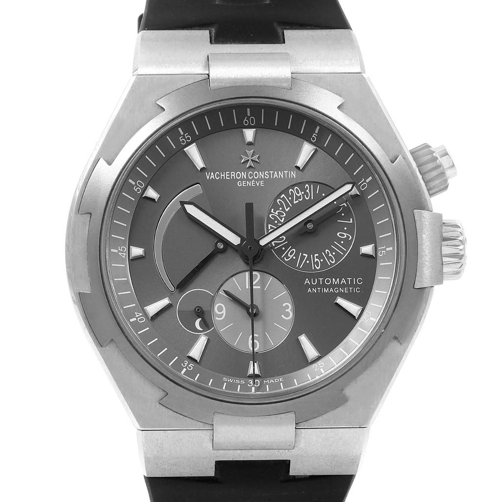 The image shows a front angle of the Vacheron Constantin Overseas 47450/000W-9511 Men's Stainless Steel Grey Dial 47450/000W-9511 Men's Stainless Steel Grey Dial watch, displaying its dial, subdials, and crown.