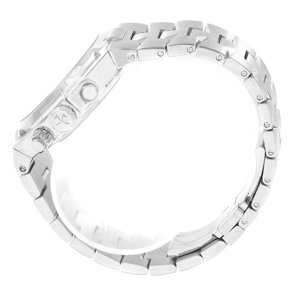 The image shows the side view of a Vacheron Constantin Overseas Men's Stainless Steel Silver Dial Men's Stainless Steel Silver Dial watch, focusing on its metal bracelet and crown.