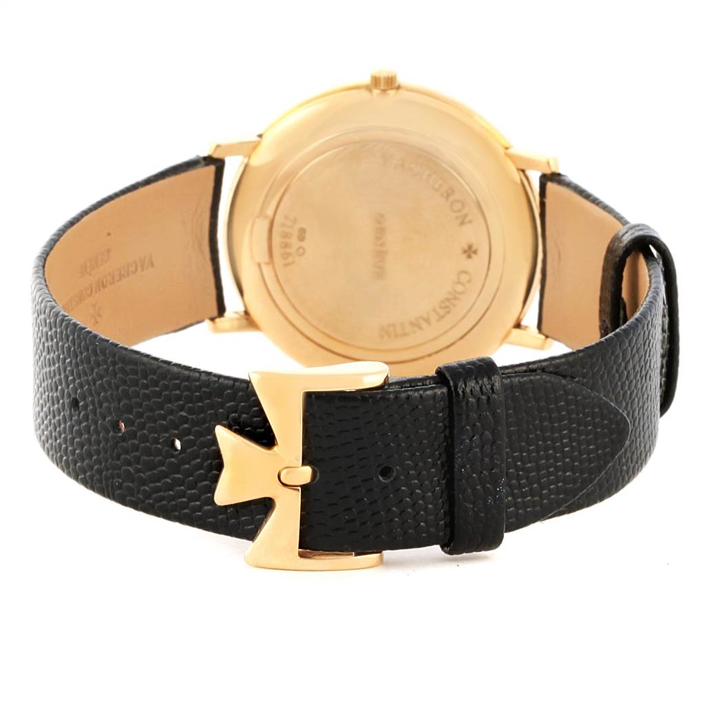 The image shows the back view of a Vacheron Constantin Patrimony 31160 Men's Yellow Gold White Dial 31160 Men's Yellow Gold White Dial watch, featuring its case back and black leather strap with gold buckle.