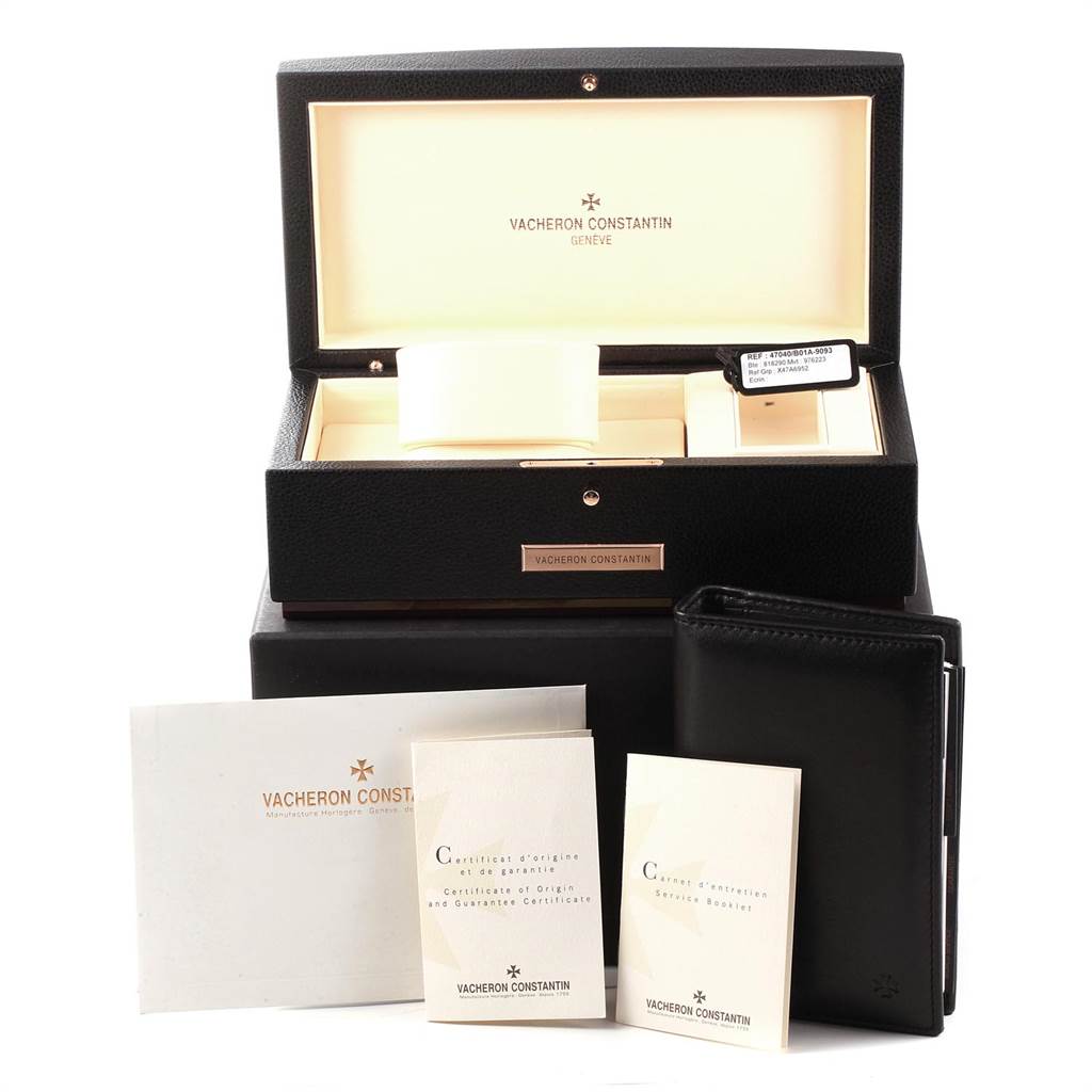 The image shows the Vacheron Constantin Overseas 47040B01A-9093 Men's Stainless Steel Silver Dial 47040B01A-9093 Men's Stainless Steel Silver Dial watch box and accompanying documents and accessories from a front angle.