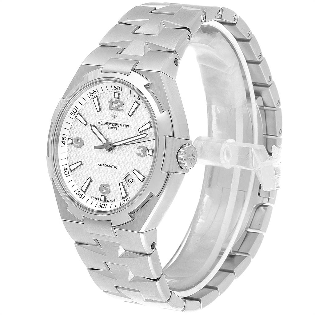 The Vacheron Constantin Overseas 47040B01A-9093 Men's Stainless Steel Silver Dial 47040B01A-9093 Men's Stainless Steel Silver Dial watch is displayed at a three-quarter angle, showcasing its face, bezel, and metal bracelet.