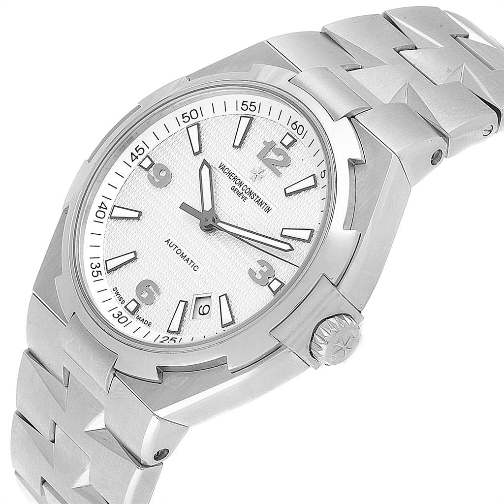 The image shows a Vacheron Constantin Overseas 47040B01A-9093 Men's Stainless Steel Silver Dial 47040B01A-9093 Men's Stainless Steel Silver Dial model watch at an angled view, highlighting the dial, bezel, crown, and part of the bracelet.