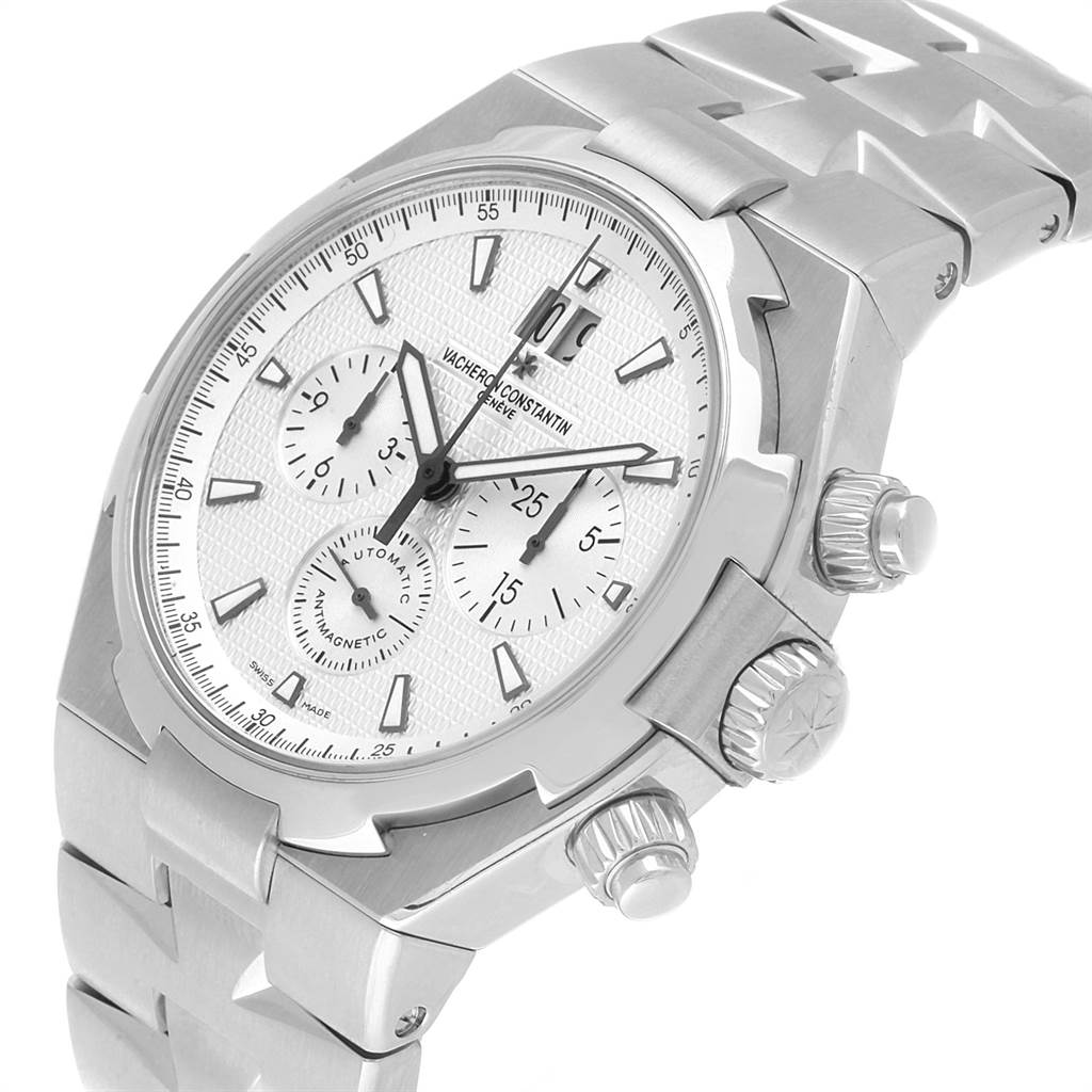 This image shows a close-up side angle of the Vacheron Constantin Overseas 49150 Men's Stainless Steel Silver Dial 49150 Men's Stainless Steel Silver Dial model watch, highlighting its face, bezel, and crown.