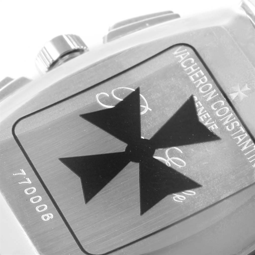 A close-up of the back of a Vintage Vacheron Constantin watch, showing the logo, brand name, and part of the case with the serial number.