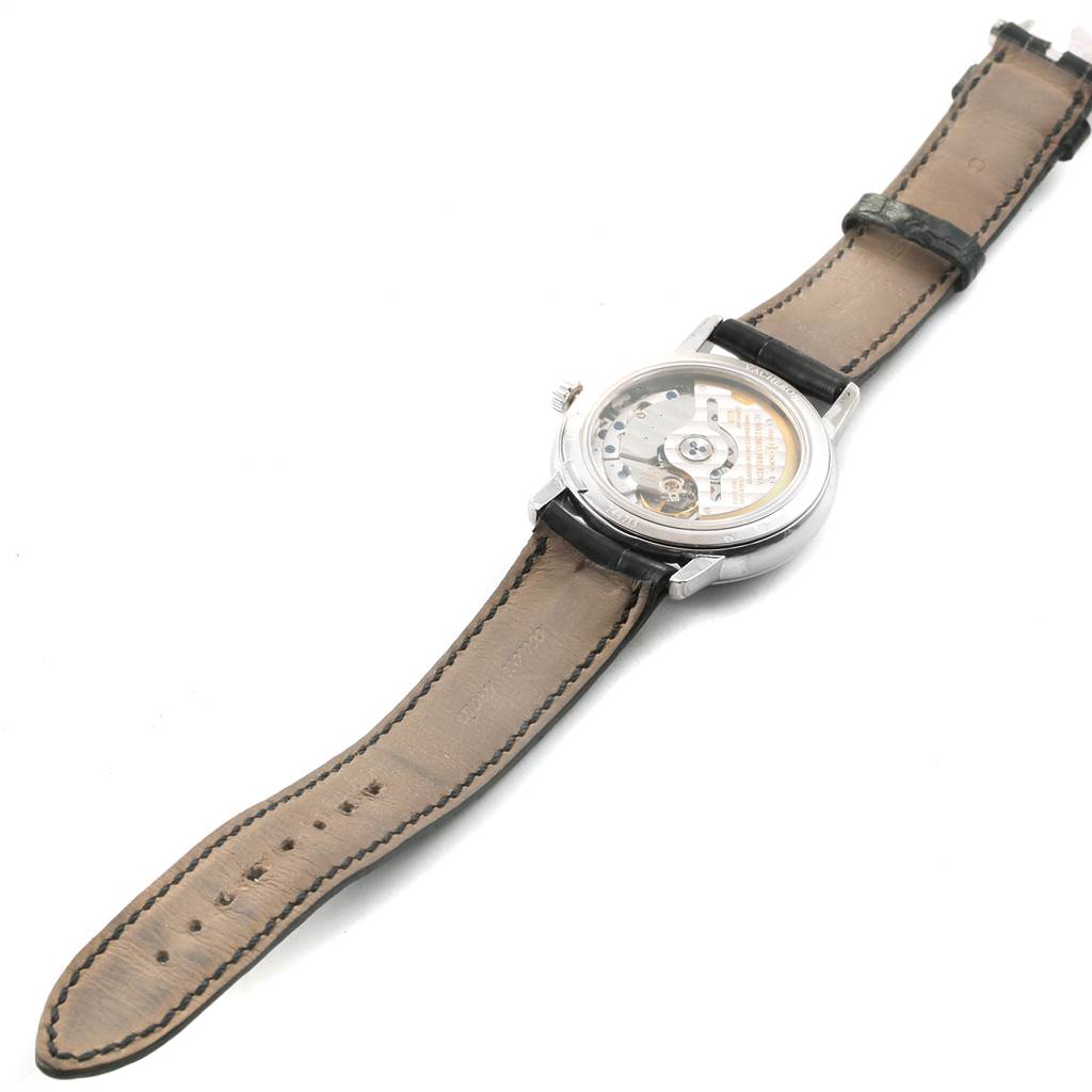 The image shows the back of a Vacheron Constantin Patrimony 47200/000G-9019 Men's White Gold Silver Dial 47200/000G-9019 Men's White Gold Silver Dial watch, highlighting its exhibition case back and leather strap.