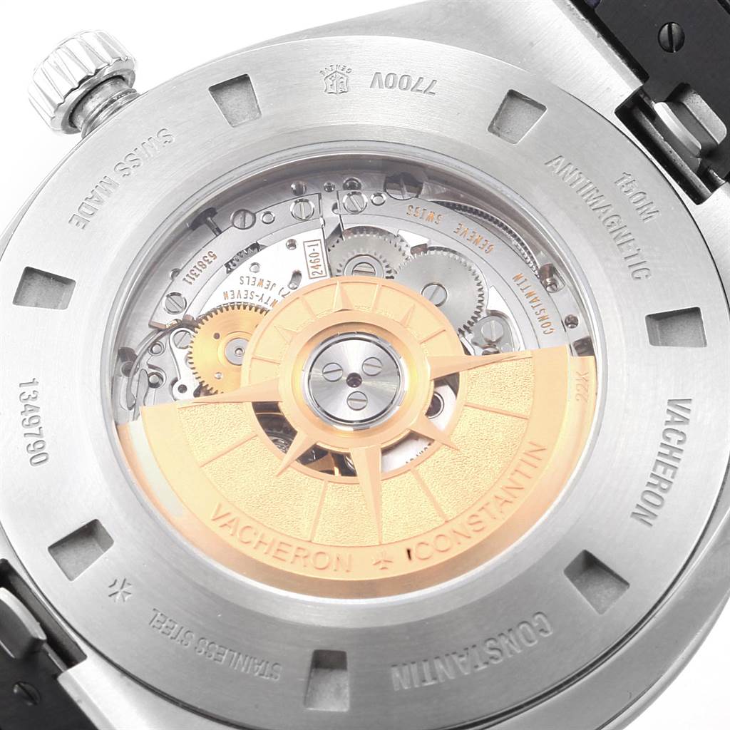 The image shows the back case view of a Vacheron Constantin Overseas 7700V/110A-B172 Men's Stainless Steel Blue Dial 7700V/110A-B172 Men's Stainless Steel Blue Dial watch, highlighting its automatic movement and rotor.