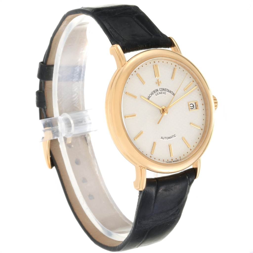 This image shows a Vacheron Constantin Vintage 47002 Men's Yellow Gold Silver Dial 47002 Men's Yellow Gold Silver Dial model watch from a side angle, highlighting its gold casing, dial, and black leather strap.