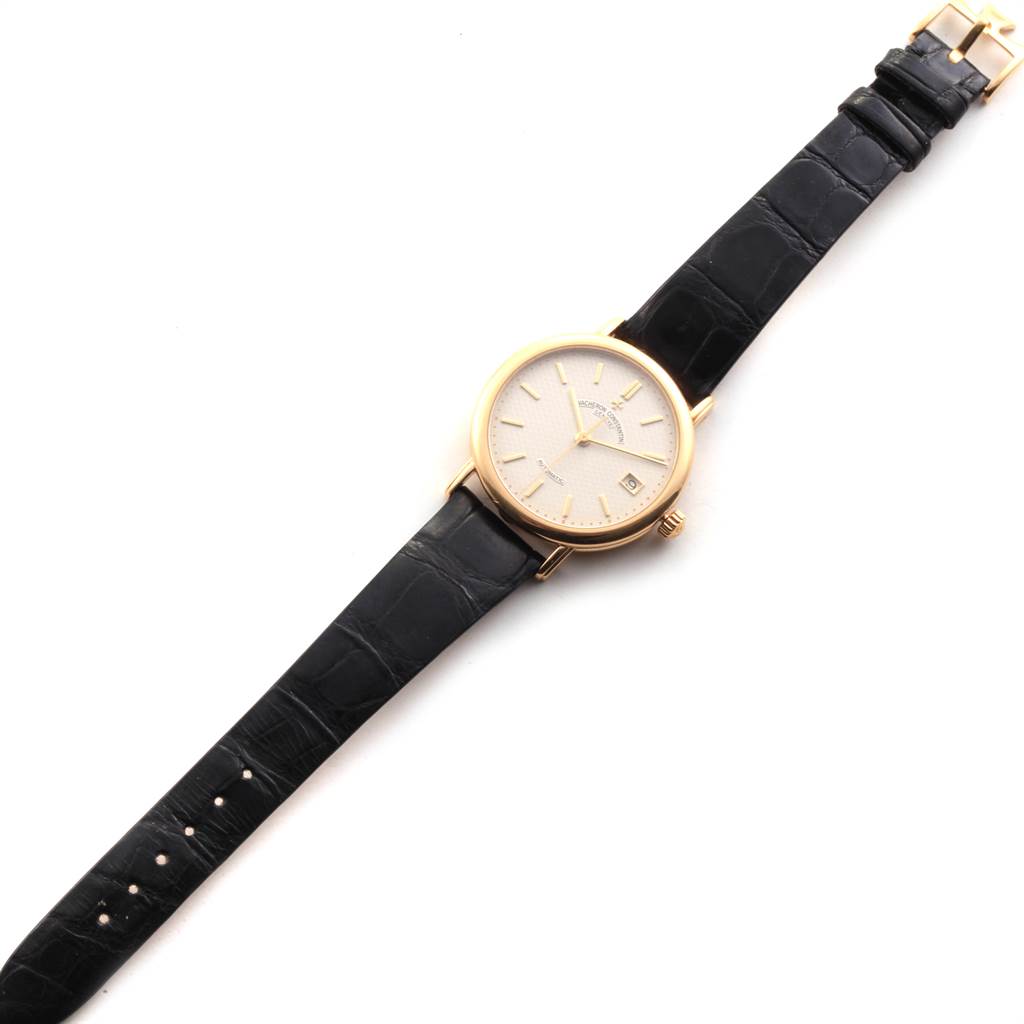 The watch is a Vintage Vacheron Constantin model, shown from a top-down angle, displaying its face, hands, case, crown, and black leather strap.