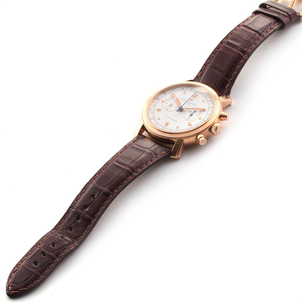 The Vacheron Constantin Malte 47120/000R-9099 Men's Rose Gold Silver Dial 47120/000R-9099 Men's Rose Gold Silver Dial watch is shown at an angled side view, highlighting its dial, crown, pushers, and leather strap.