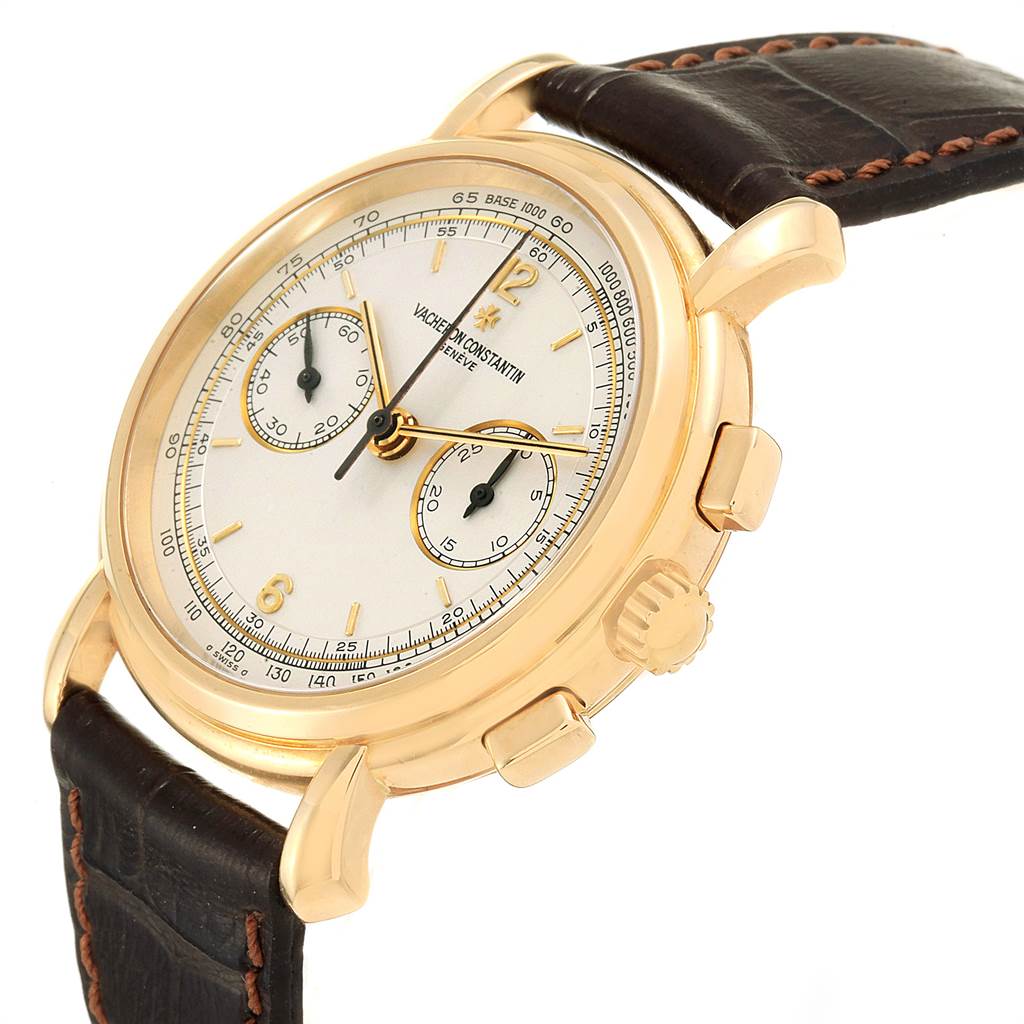 The image shows a side and front angle of a Vacheron Constantin Historiques 47101/1 Men's Yellow Gold Silver Dial 47101/1 Men's Yellow Gold Silver Dial watch, highlighting its round gold case, crown, pushers, dial, and leather strap.
