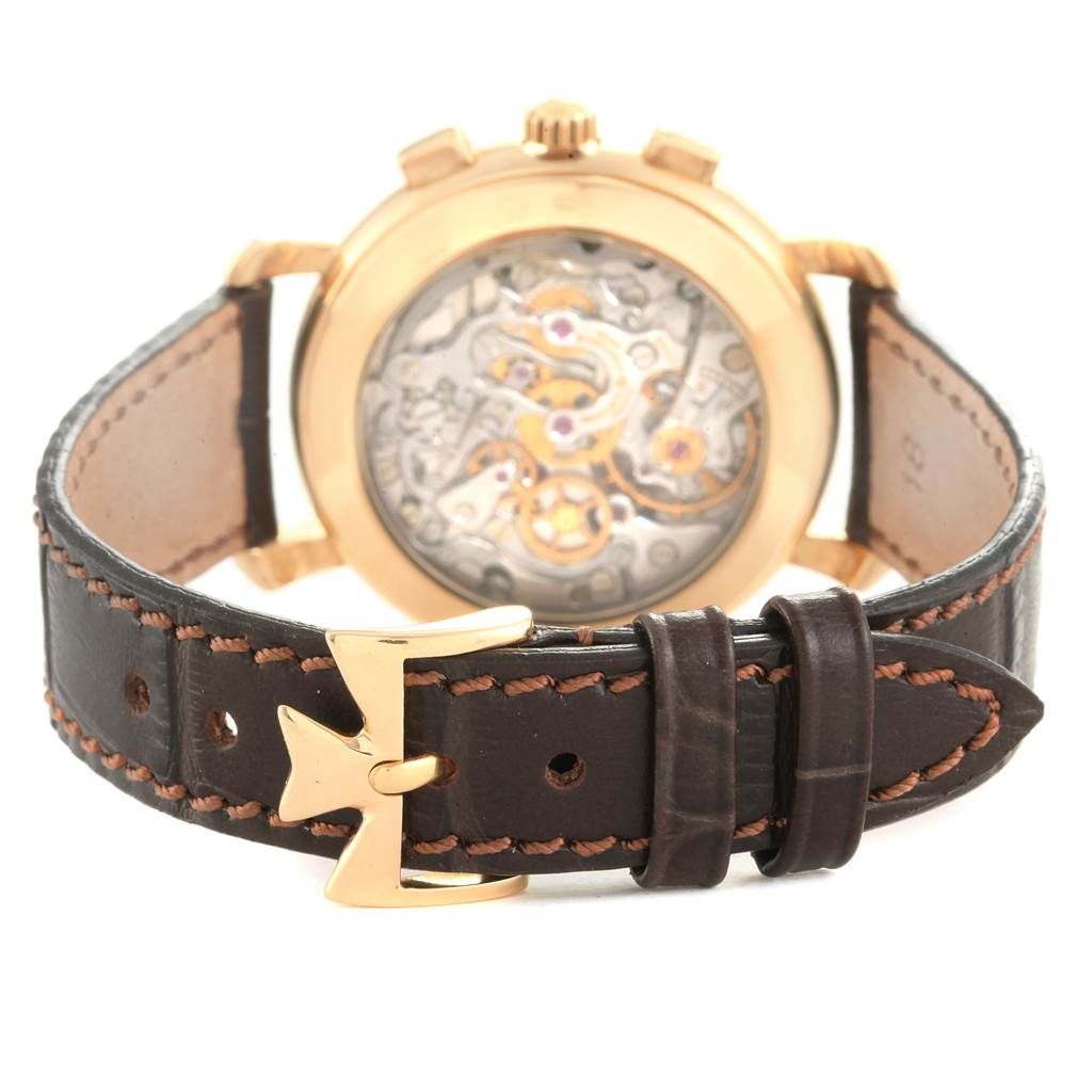 The image shows the back of a Vacheron Constantin Historiques 47101/1 Men's Yellow Gold Silver Dial 47101/1 Men's Yellow Gold Silver Dial watch, focusing on the open case back and leather strap with a gold buckle.