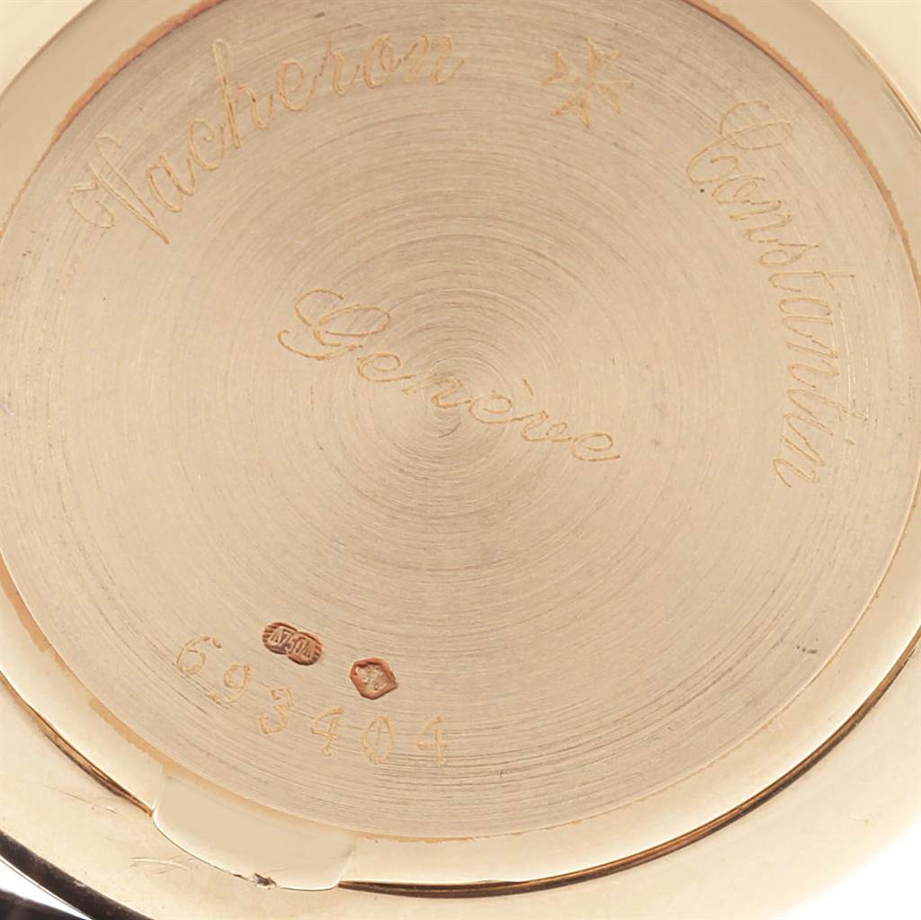 The image shows the engraved back case of a Vacheron Constantin Patrimony 31160 Men's Yellow Gold White Dial 31160 Men's Yellow Gold White Dial watch.