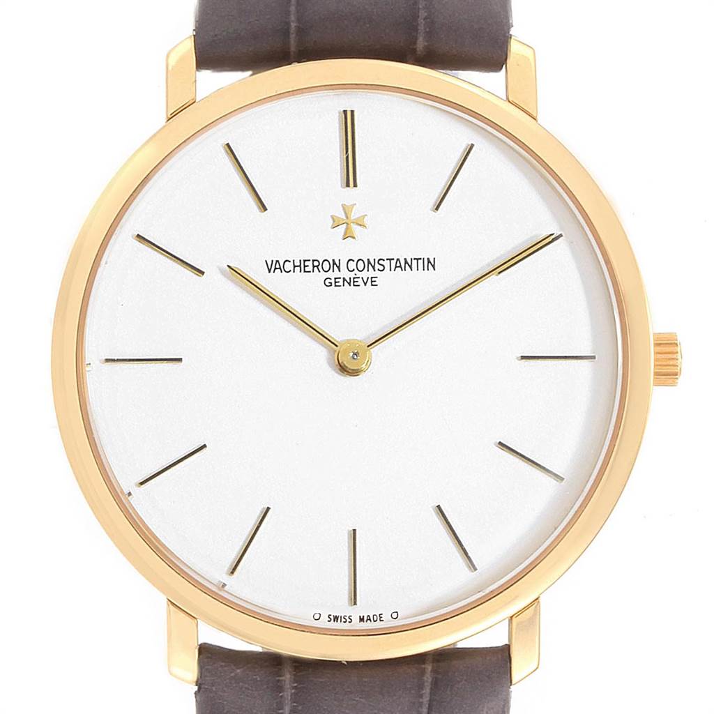 This is a close-up view of the Vacheron Constantin Patrimony 31160 Men's Yellow Gold White Dial 31160 Men's Yellow Gold White Dial watch, showing its face, gold bezel, and brown leather strap.