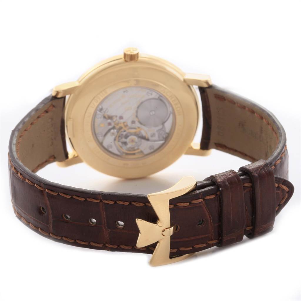 The image shows the back view of a Vacheron Constantin Patrimony 31160 Men's Yellow Gold Silver Dial 31160 Men's Yellow Gold Silver Dial watch, highlighting its case back and leather strap with a branded clasp.