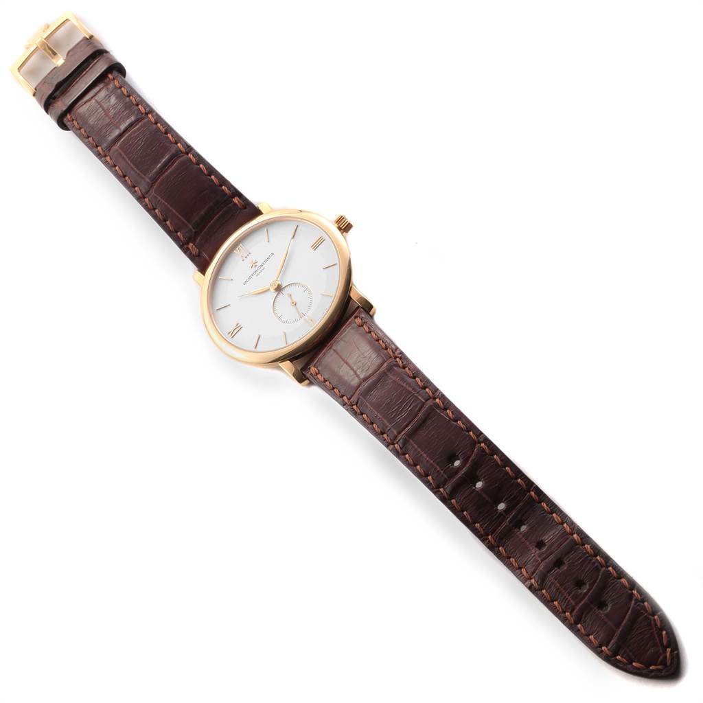 The Vacheron Constantin Patrimony 31160 Men's Yellow Gold Silver Dial 31160 Men's Yellow Gold Silver Dial watch is shown from a top-down angle, displaying the dial, leather strap, crown, and buckle.