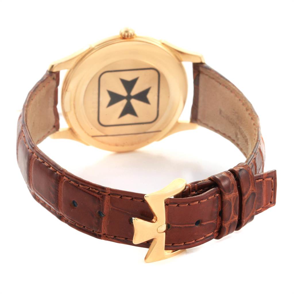 The image shows the back case and leather strap of a Vacheron Constantin Historiques 92239 Men's Yellow Gold Silver Dial 92239 Men's Yellow Gold Silver Dial watch, highlighting the maltese cross emblem.