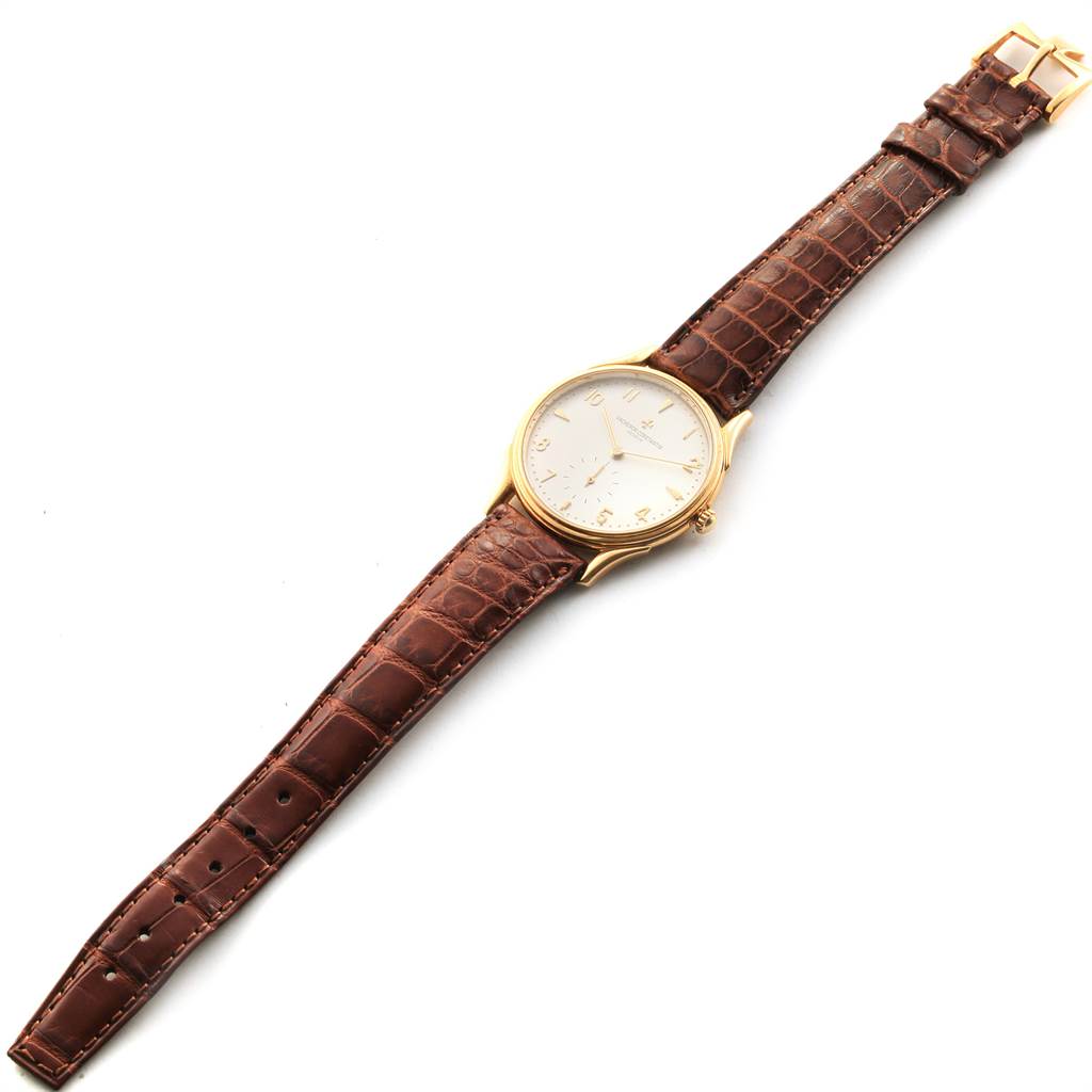 The Vacheron Constantin Historiques 92239 Men's Yellow Gold Silver Dial 92239 Men's Yellow Gold Silver Dial model watch is shown fully laid out from an overhead angle, displaying its dial and brown strap.