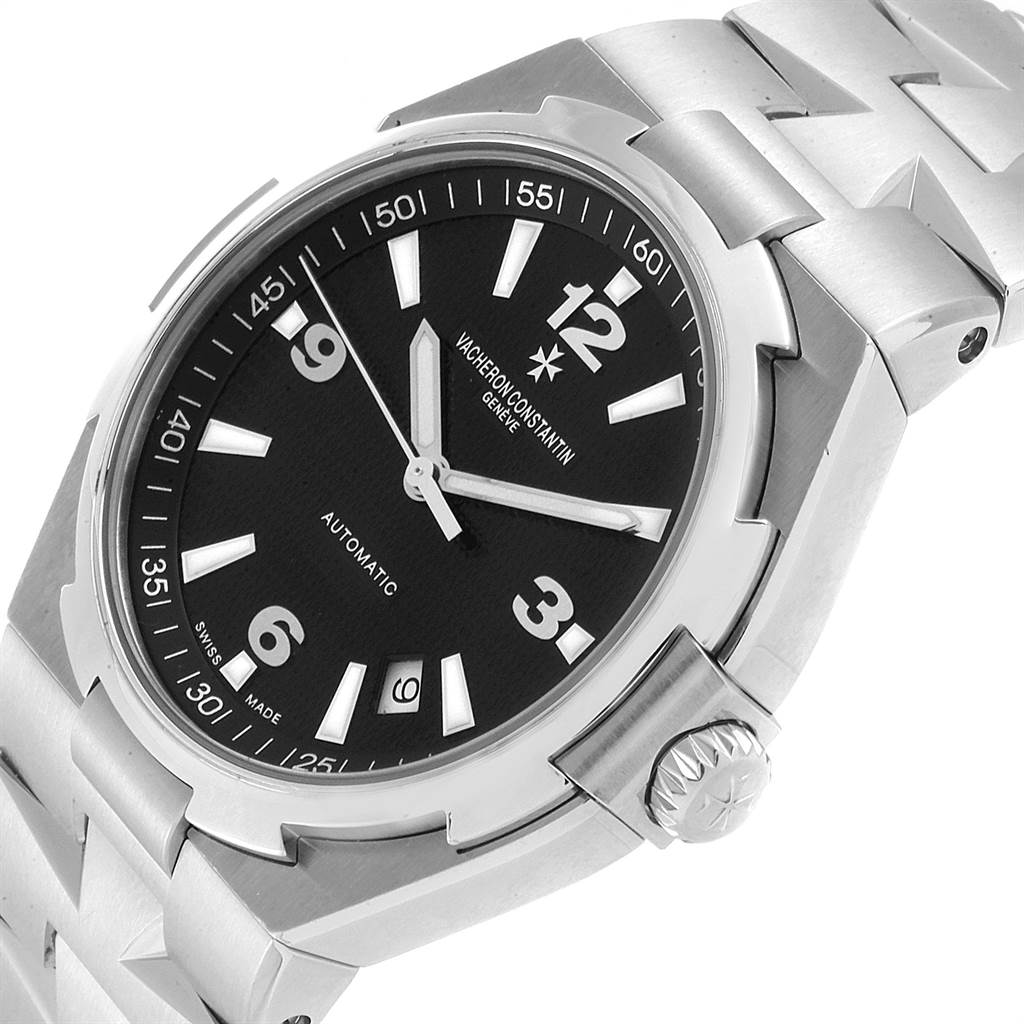 The image shows the Vacheron Constantin Overseas 47040/B01A-9094 Men's Stainless Steel Black Dial 47040/B01A-9094 Men's Stainless Steel Black Dial watch at an angled view, highlighting the dial, crown, and stainless steel bracelet.