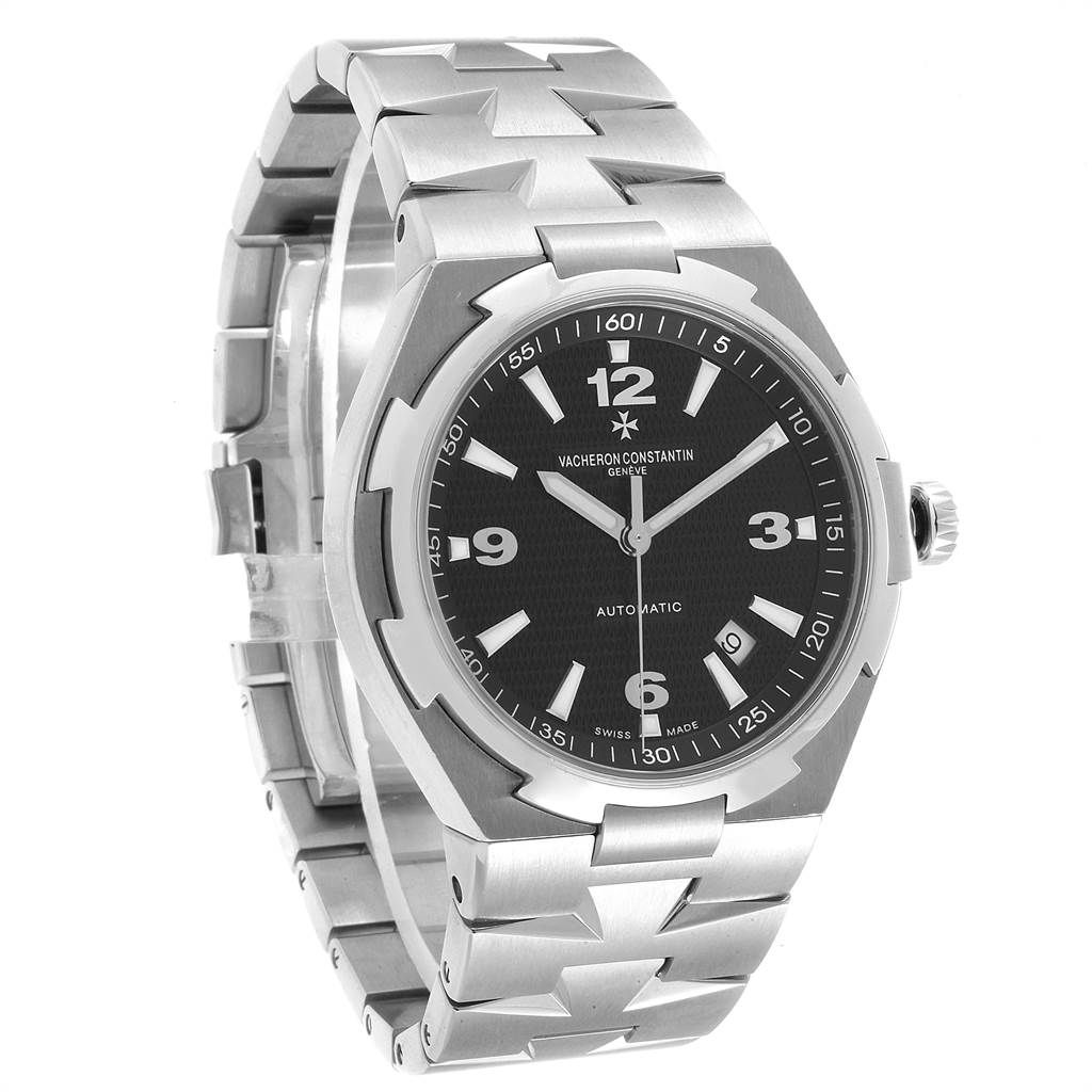 The image shows a Vacheron Constantin Overseas 47040/B01A-9094 Men's Stainless Steel Black Dial 47040/B01A-9094 Men's Stainless Steel Black Dial model watch from a slightly elevated angle, highlighting the dial, bezel, crown, and bracelet.