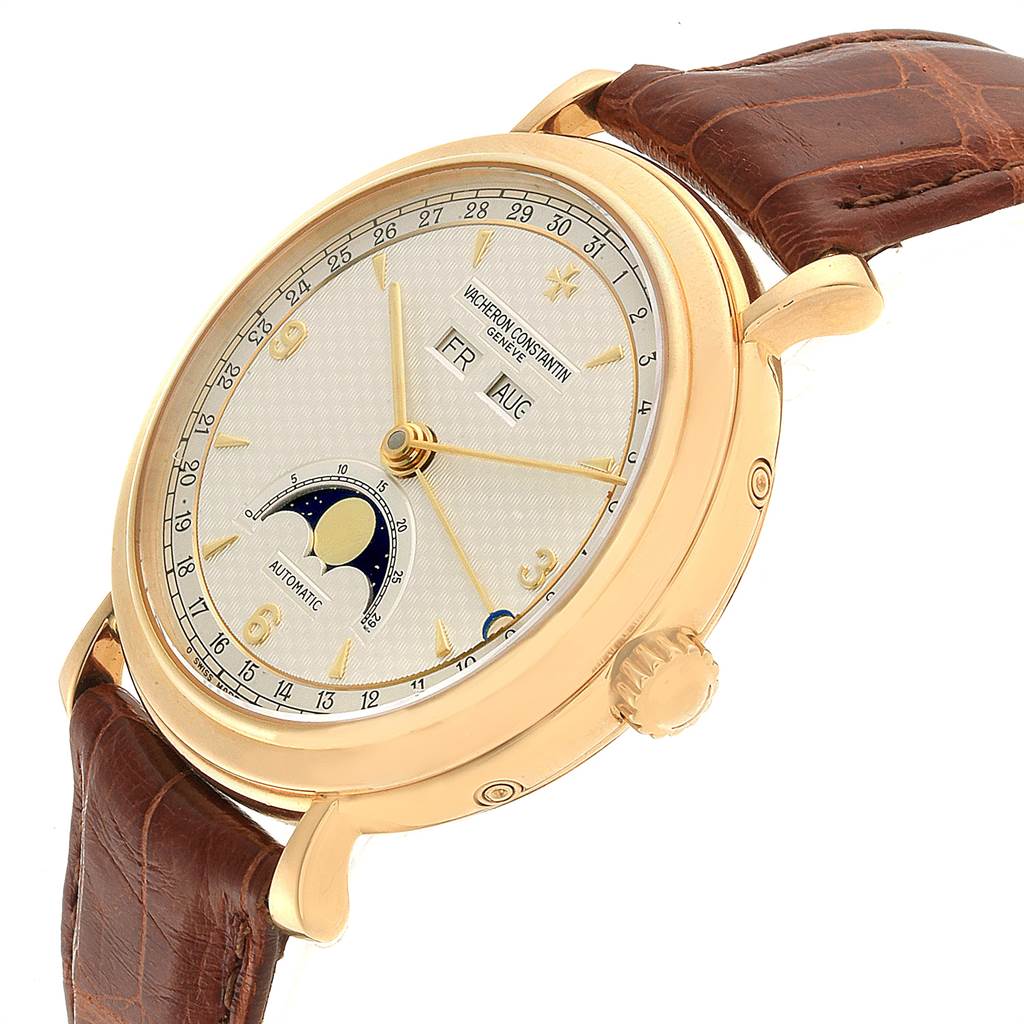 The image shows a side angle of the Vacheron Constantin Vintage 47050 Men's Yellow Gold Silver Dial 47050 Men's Yellow Gold Silver Dial watch, highlighting the dial, leather strap, crown, and moon phase indicator.