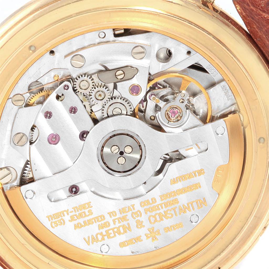 The image shows the intricate mechanical movement of the Vintage Vacheron Constantin watch from a back angle, showcasing gears and inscriptions.