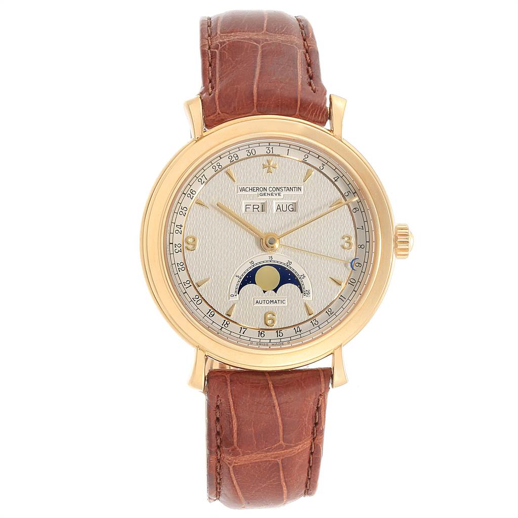 The Vacheron Constantin Vintage 47050 Men's Yellow Gold Silver Dial 47050 Men's Yellow Gold Silver Dial watch is shown from the front, displaying its dial, gold case, and brown leather strap.