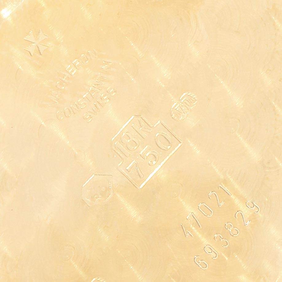 The image shows the inner case back of a Vacheron Constantin Patrimony VACHERON CONSTANTIN Men's Yellow Gold Silver Dial VACHERON CONSTANTIN Men's Yellow Gold Silver Dial watch with engraving details.