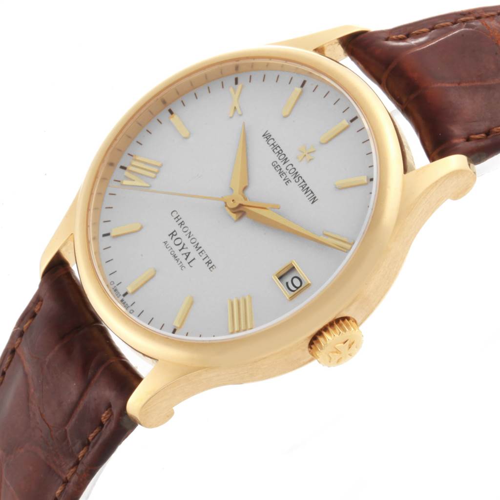 This image shows a Vacheron Constantin Patrimony VACHERON CONSTANTIN Men's Yellow Gold Silver Dial VACHERON CONSTANTIN Men's Yellow Gold Silver Dial watch angled to display the face, gold case, crown, and brown leather strap.