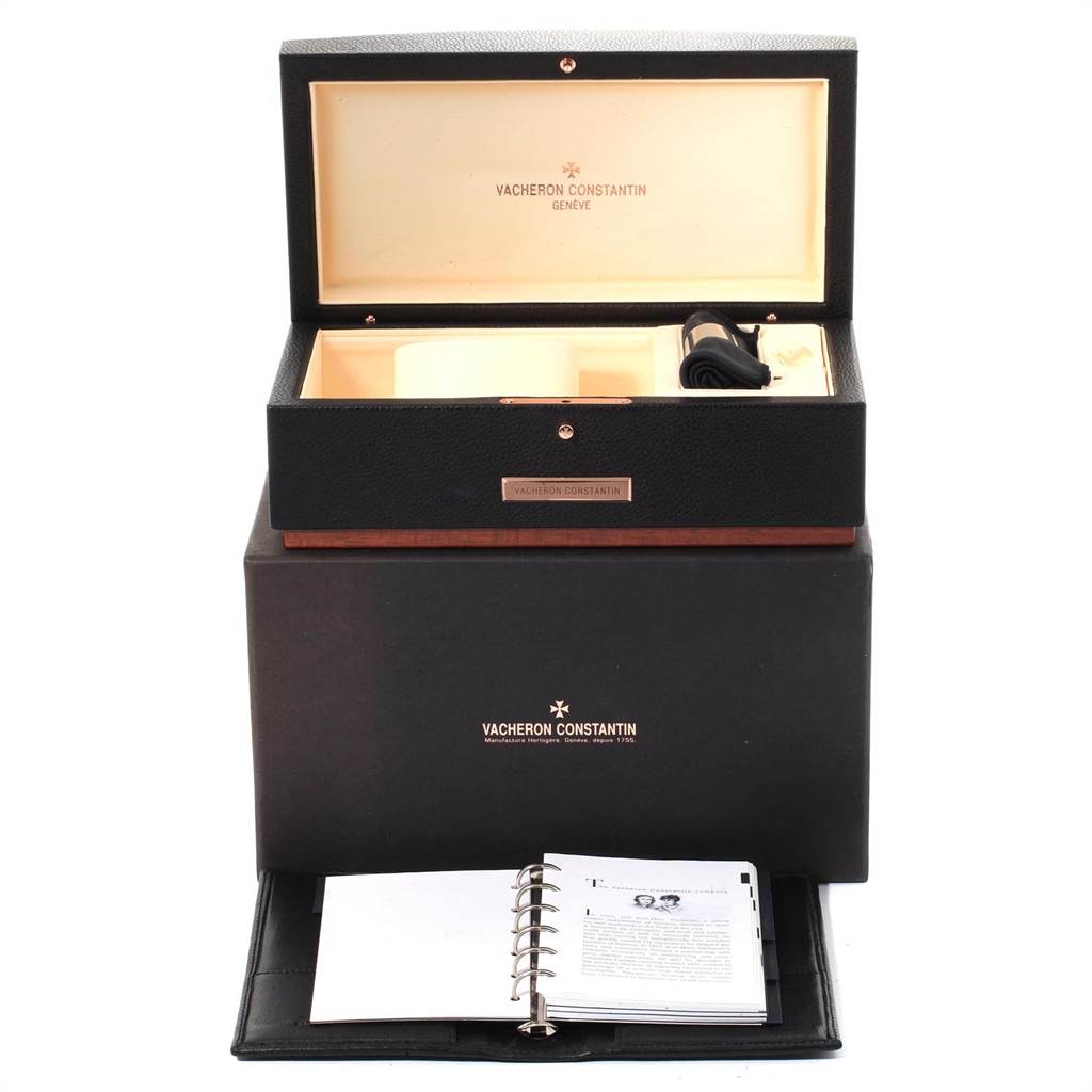 This image shows packaging, including an open box and documentation, for the Patrimony model by Vacheron Constantin.