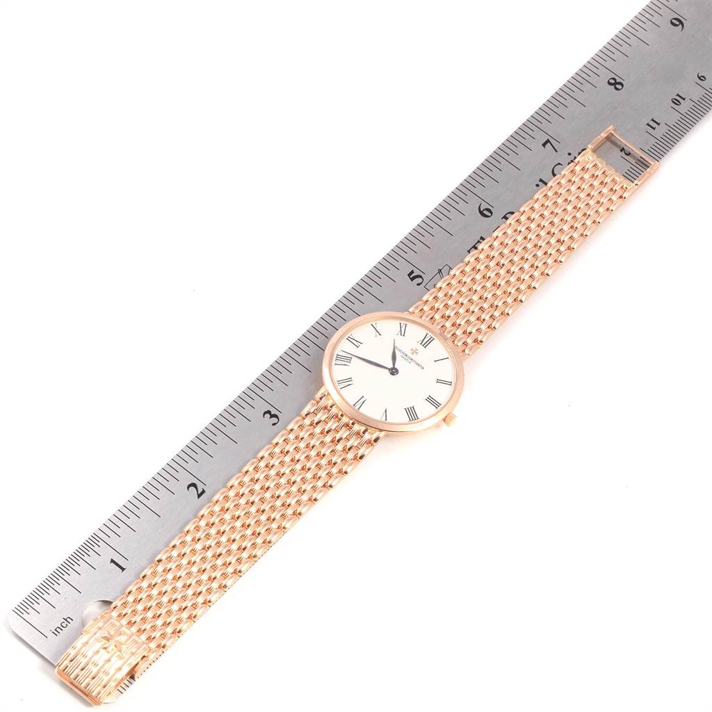 The image shows a Vacheron Constantin Patrimony 33093 Men's Rose Gold White Dial 33093 Men's Rose Gold White Dial watch laid flat against a ruler, displaying the watch face and the entire woven metal strap.