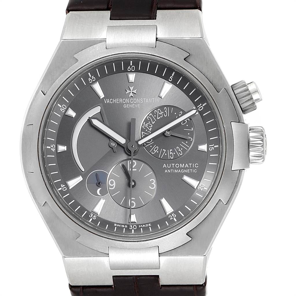 The image shows the dial and case of the Vacheron Constantin Overseas 47450/000W-9511 Men's Stainless Steel Grey Dial 47450/000W-9511 Men's Stainless Steel Grey Dial watch, featuring subdials and the brand's name clearly displayed.