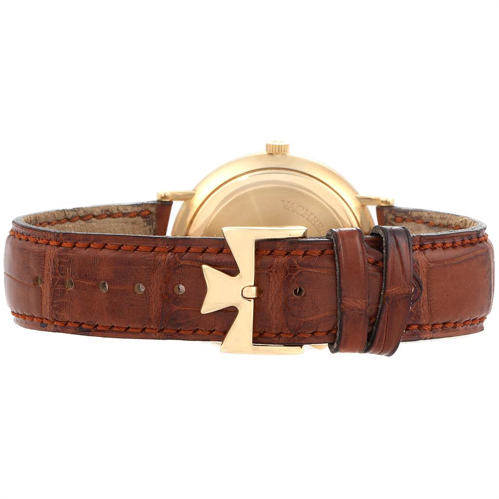 The image shows the back view of a Vacheron Constantin Patrimony 42002 Men
s Yellow Gold White Dial 42002 Men
s Yellow Gold White Dial watch, highlighting its brown leather strap and gold buckle.