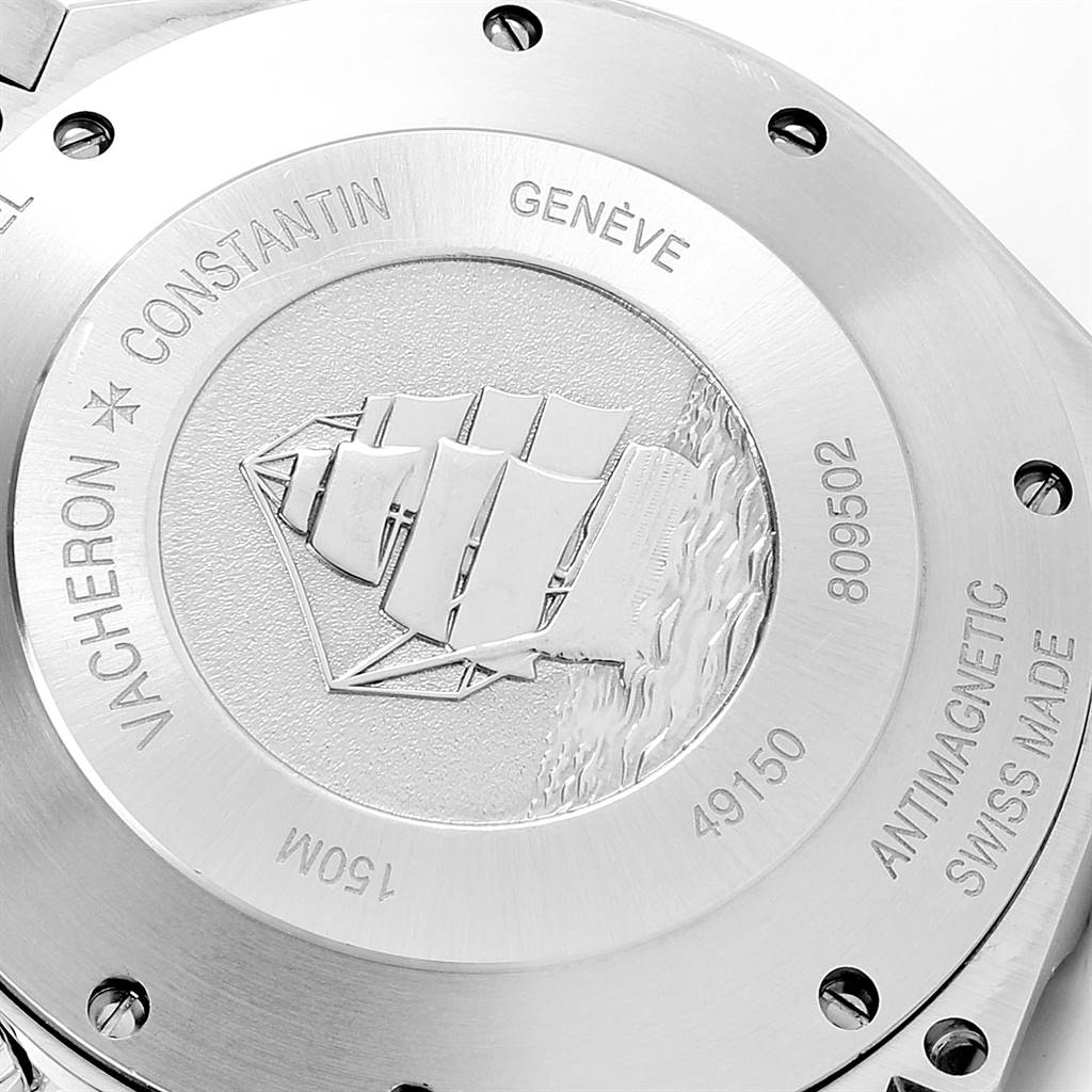 This image shows the engraved back case of the Vacheron Constantin Overseas 49150 Men's Stainless Steel Black Dial 49150 Men's Stainless Steel Black Dial watch, highlighting various inscriptions and a ship design.