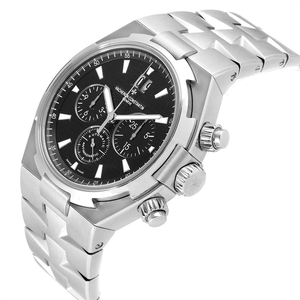 The image shows a side angle of the Vacheron Constantin Overseas 49150 Men's Stainless Steel Black Dial 49150 Men's Stainless Steel Black Dial watch, highlighting the bezel, dial, crown, and part of the bracelet.