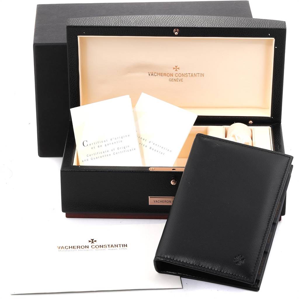 The image shows the accessories of the Vacheron Constantin Overseas 49150 Men's Stainless Steel Black Dial 49150 Men's Stainless Steel Black Dial model, including a branded box, wallet, and documentation.