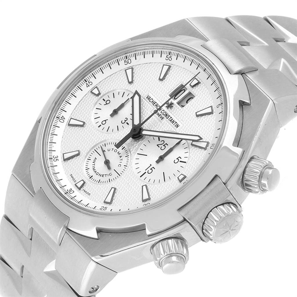 This Vacheron Constantin Overseas 49150 Men
s Stainless Steel Silver Dial 49150 Men
s Stainless Steel Silver Dial watch is shown from an angled close-up, highlighting its dial, crown, and pushers.