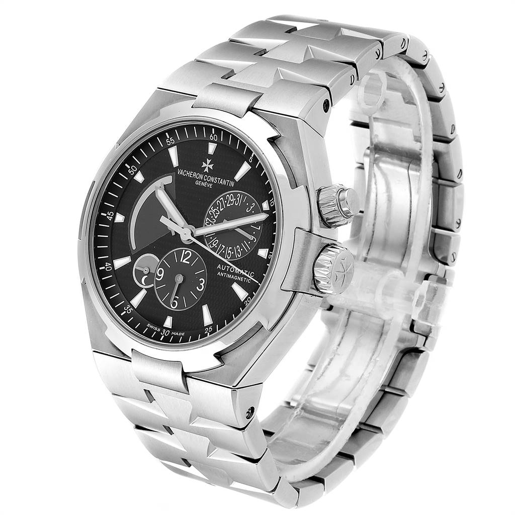 The image shows a Vacheron Constantin Overseas 47450/B01A-9227 Men
s Stainless Steel Black Dial 47450/B01A-9227 Men
s Stainless Steel Black Dial watch angled from the front-left, highlighting the face, crown, and part of the bracelet.
