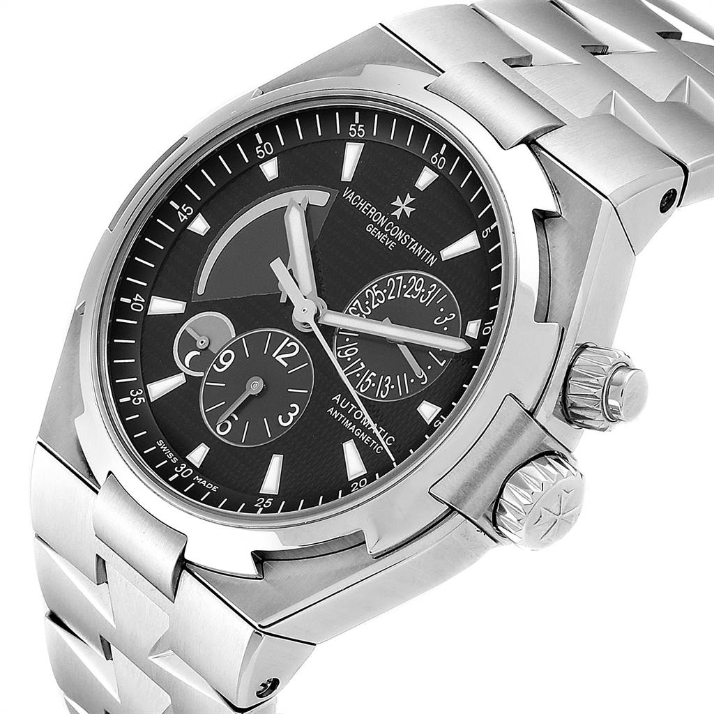 This is a close-up view of the Vacheron Constantin Overseas 47450/B01A-9227 Men
s Stainless Steel Black Dial 47450/B01A-9227 Men
s Stainless Steel Black Dial watch showing the dial, crown, and part of the bracelet.